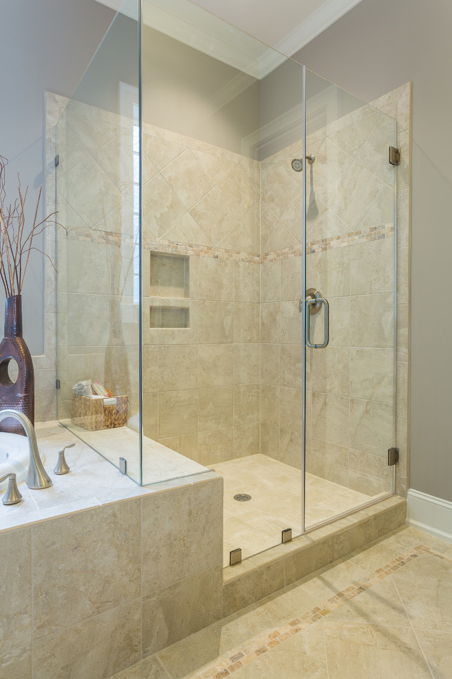 Photo of a mid-sized transitional master bathroom in Raleigh with porcelain tile, porcelain floors, an undermount sink, dark wood cabinets, granite benchtops, a corner shower, beige tile and beige walls.