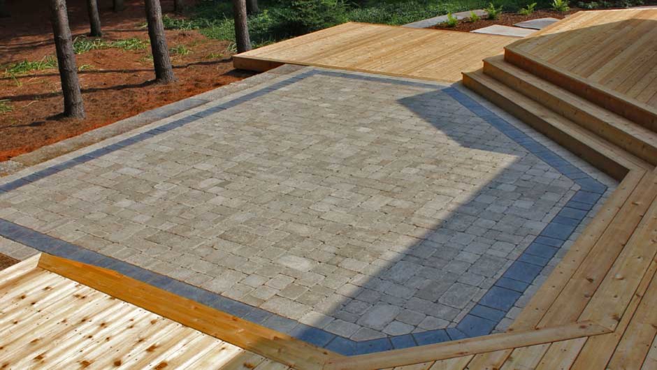 Deck - large rustic backyard deck idea in Toronto with no cover