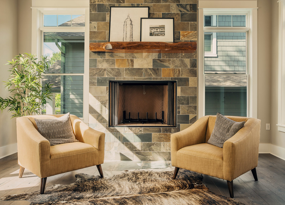 Design ideas for a transitional formal living room in Austin with dark hardwood floors, a standard fireplace and a tile fireplace surround.