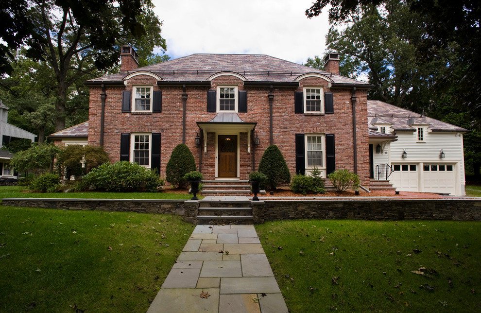 Design ideas for a mid-sized traditional two-storey brick exterior in Boston.