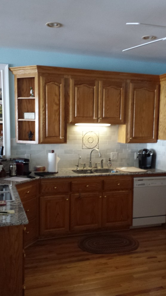 Inspiration for a transitional kitchen remodel with shaker cabinets, white cabinets and an island