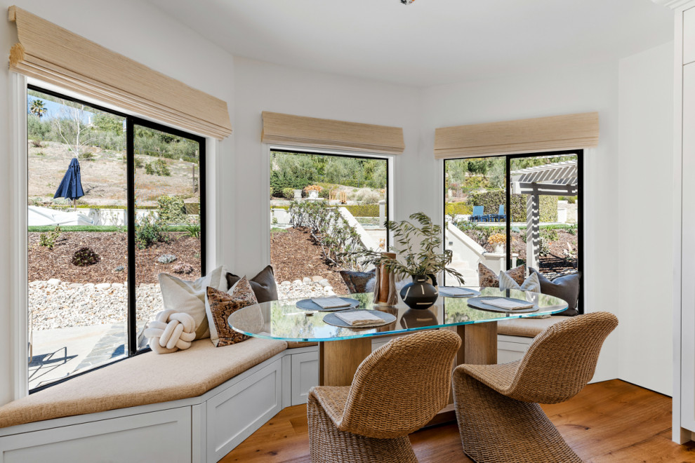 Inspiration for an expansive transitional dining room in Los Angeles with light hardwood floors and beige floor.