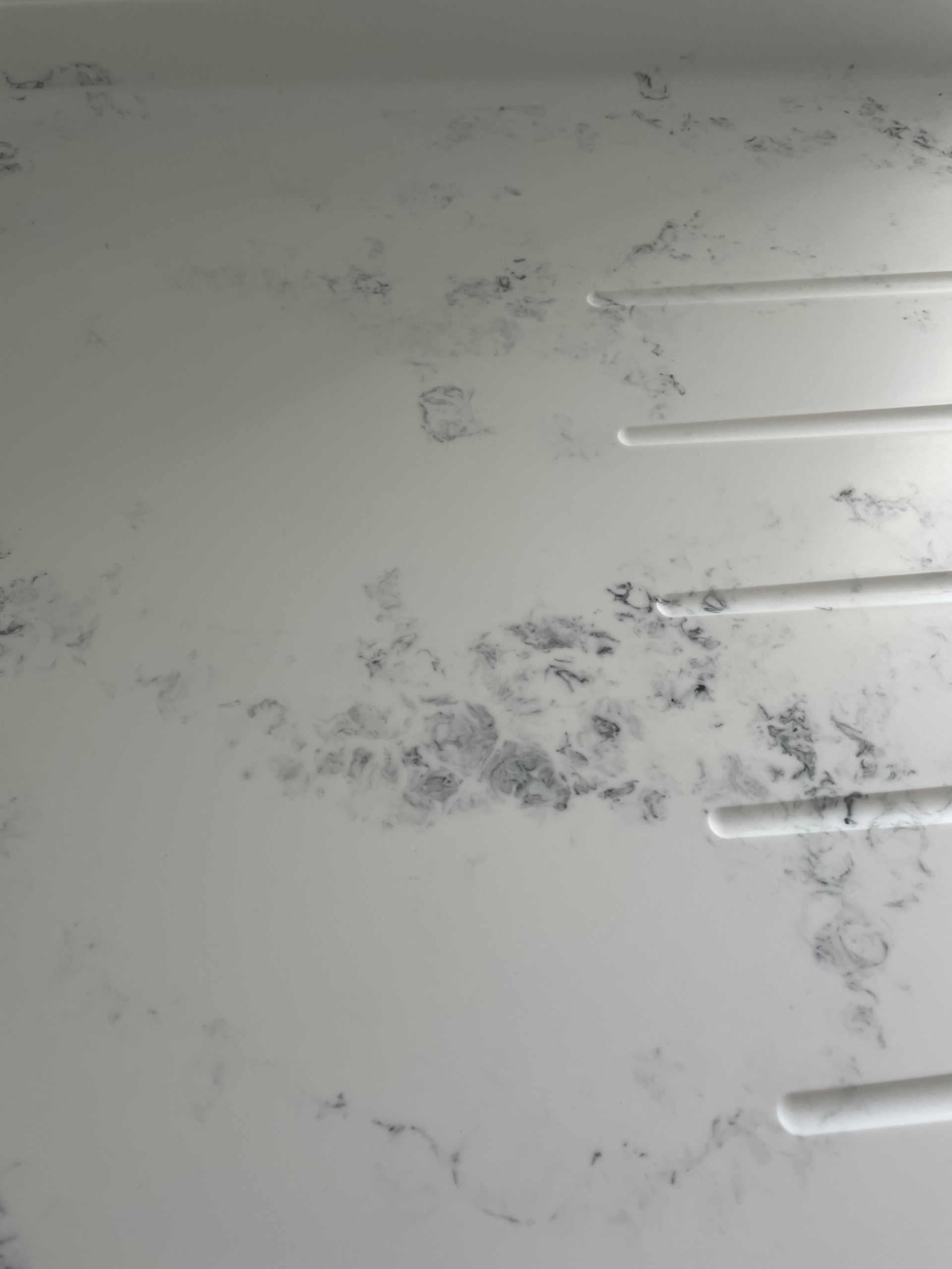 High Gloss Gravel Handleless Kitchen with White and Grey Solid Surface Tops