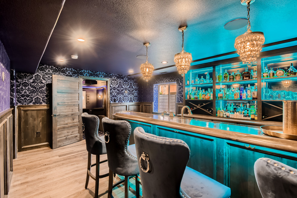This is an example of a large traditional galley home bar in Denver.