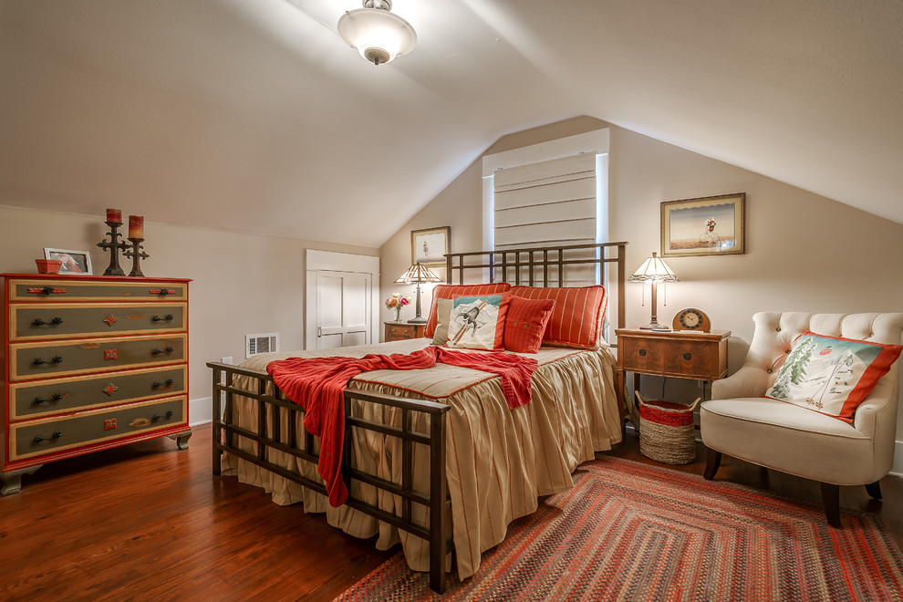 Mid-sized arts and crafts bedroom in Dallas with beige walls, dark hardwood floors, no fireplace and orange floor.