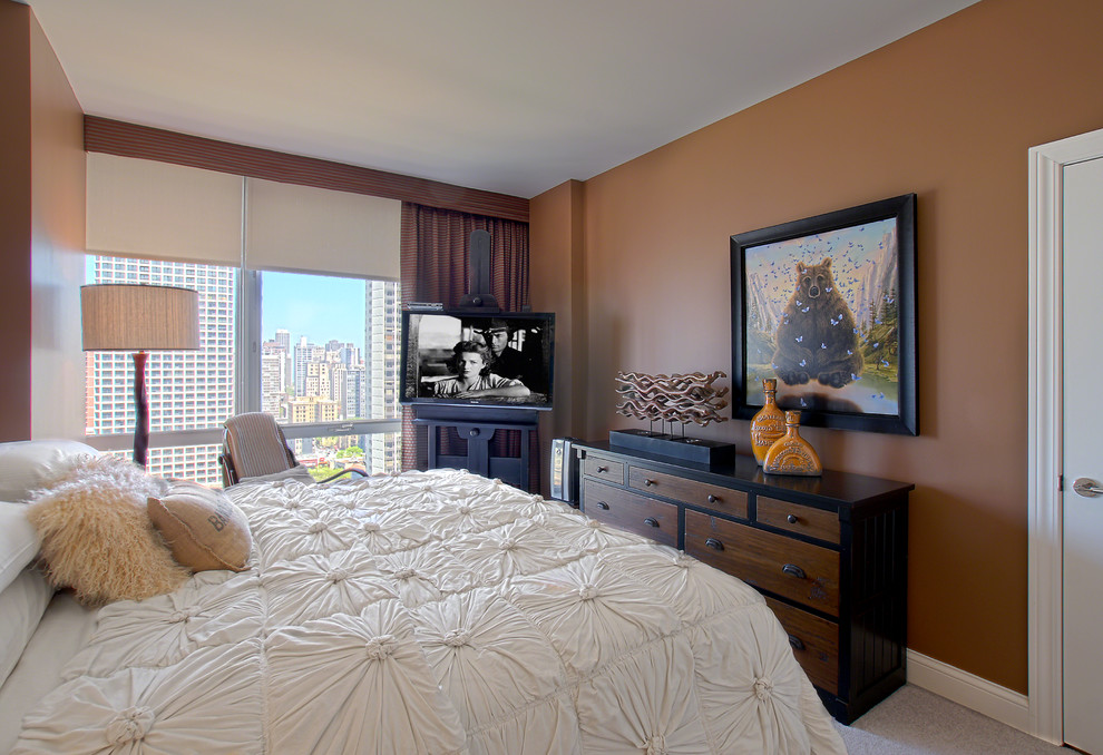 Photo of a small eclectic guest bedroom in Chicago with brown walls, carpet, beige floor and no fireplace.