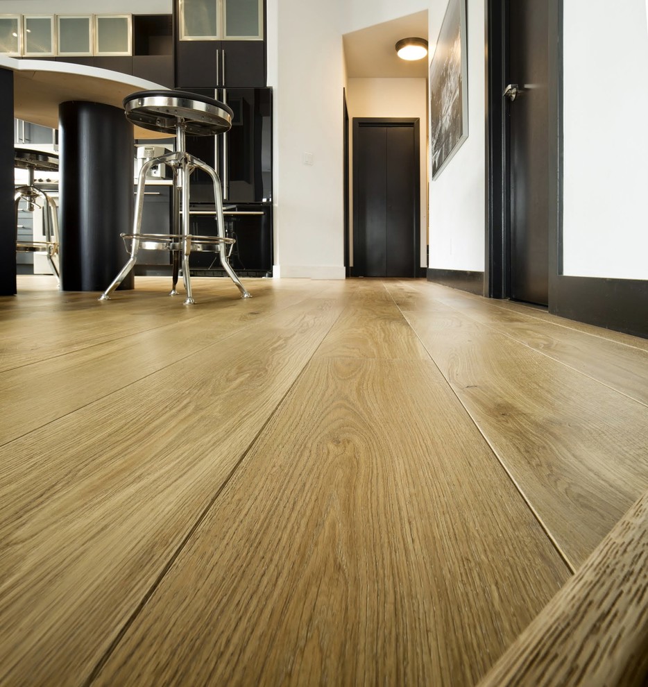Example of a transitional light wood floor home design design in Calgary