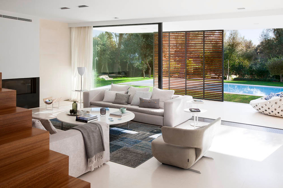 Large contemporary formal open concept living room in Other with white walls.