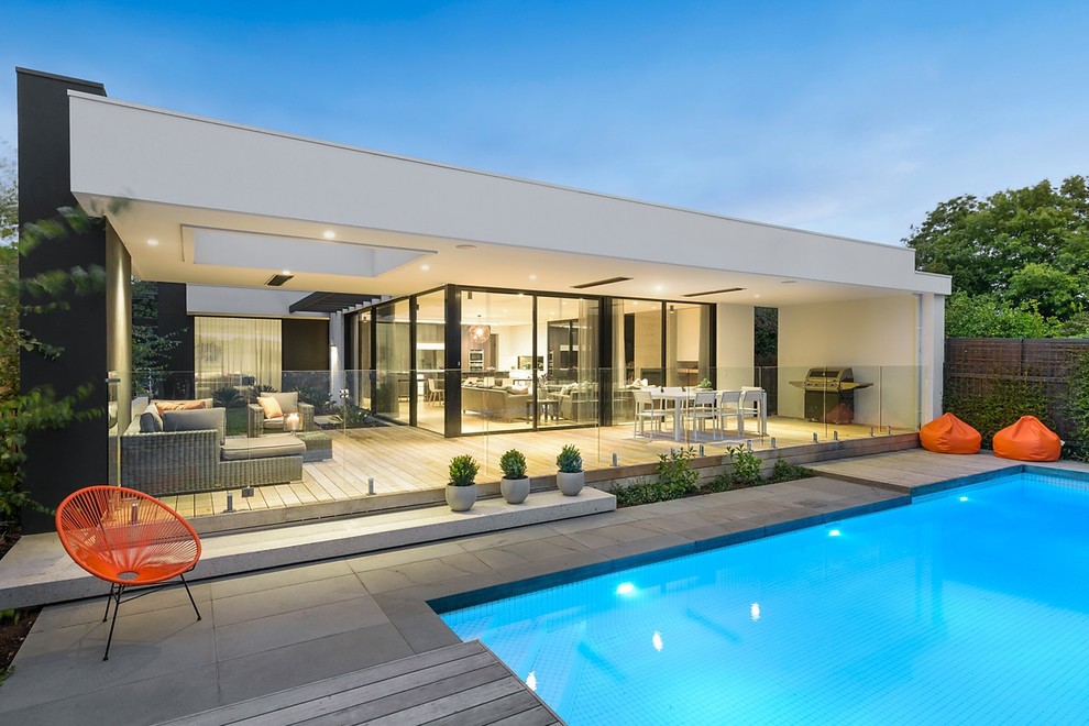 Large contemporary backyard pool in Melbourne.