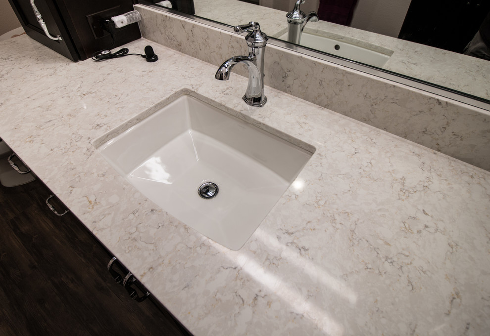 Mid-sized transitional master white tile and subway tile brown floor home design photo with flat-panel cabinets, dark wood cabinets, a two-piece toilet, pink walls, an undermount sink and quartz countertops