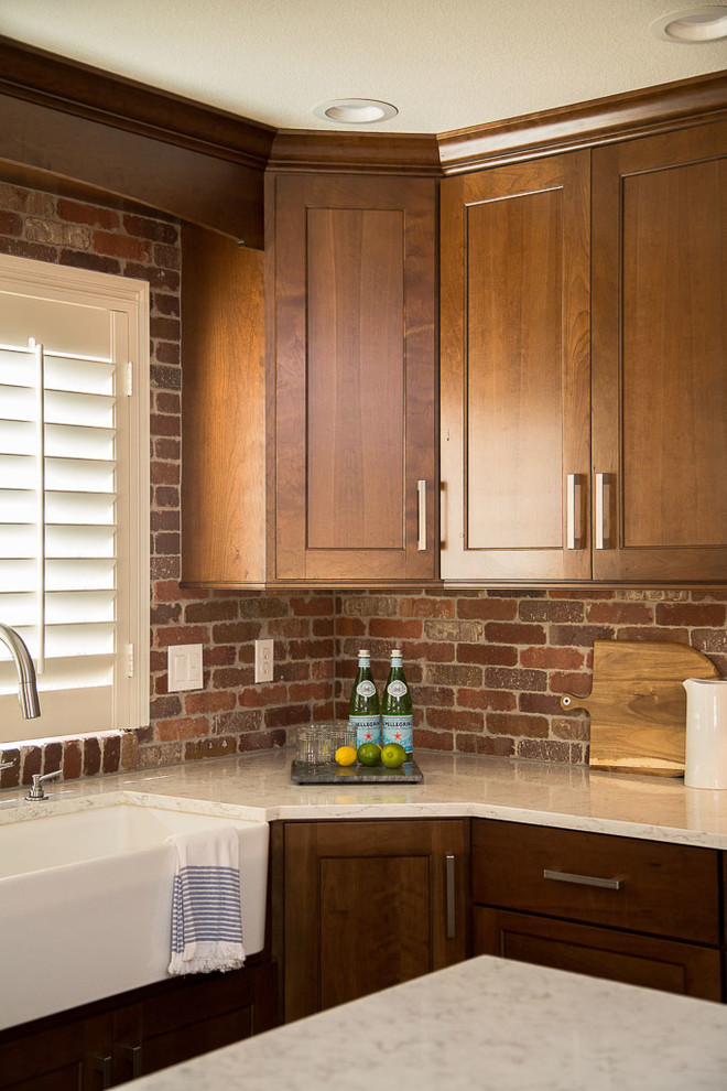 Example of a large mountain style l-shaped dark wood floor eat-in kitchen design in Denver with a farmhouse sink, shaker cabinets, dark wood cabinets, quartz countertops, red backsplash, terra-cotta backsplash, stainless steel appliances and an island