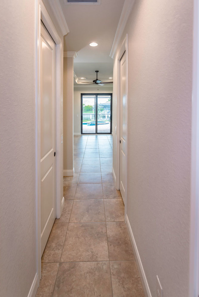 Example of a transitional home design design in Miami