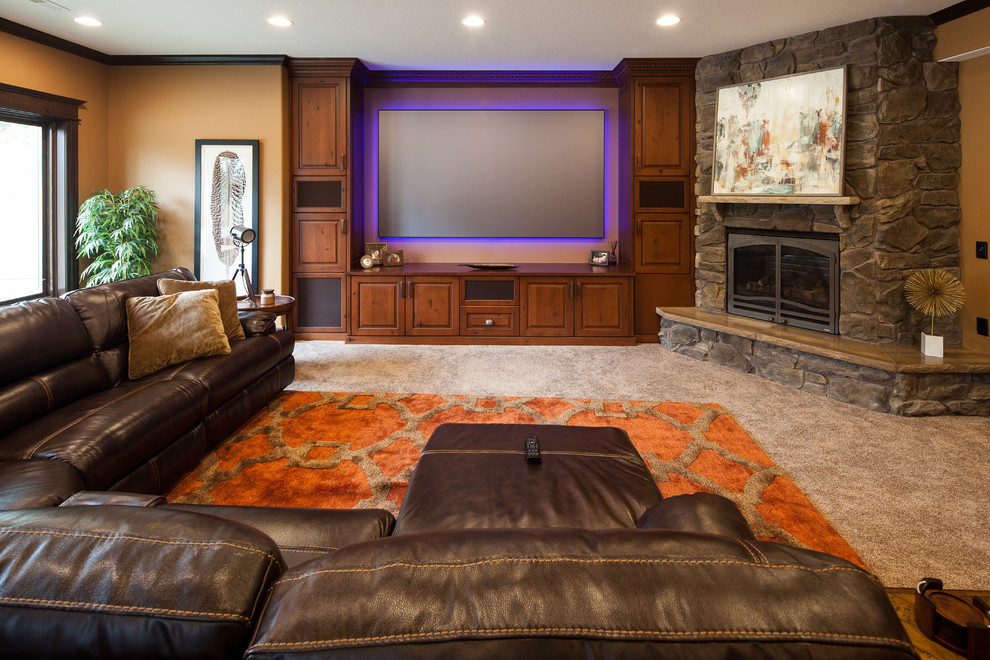 Inspiration for a large traditional formal enclosed living room in Chicago with brown walls, carpet, a standard fireplace, a stone fireplace surround and a wall-mounted tv.