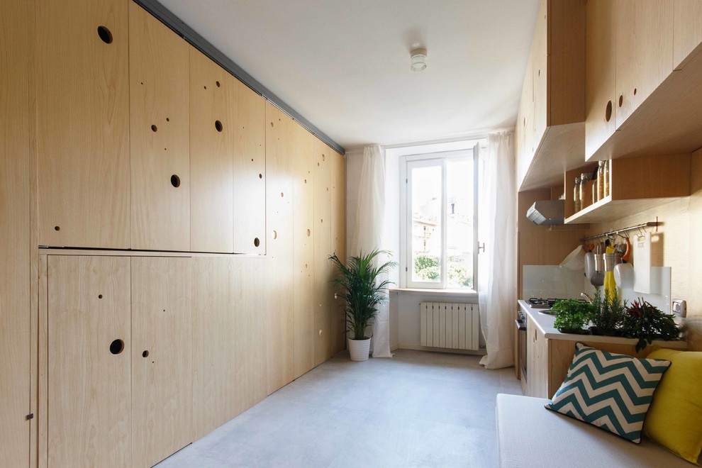 Ispirazione per un piccolo soggiorno minimalista con pareti bianche e pavimento in cemento