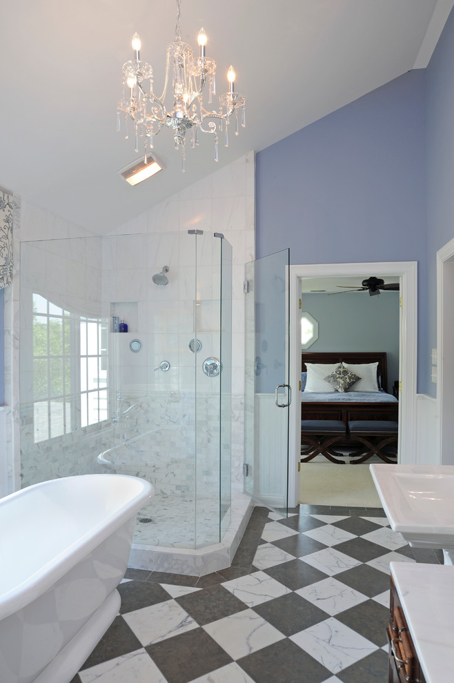 Photo of a traditional master bathroom in Columbus with a freestanding tub, a pedestal sink, a corner shower, blue walls, a two-piece toilet, marble floors and multi-coloured floor.