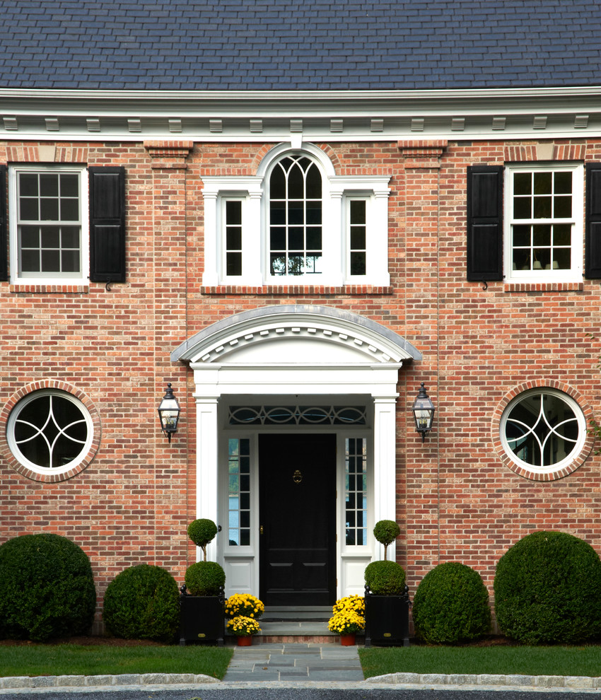 Design ideas for a traditional two-storey brick exterior in New York.