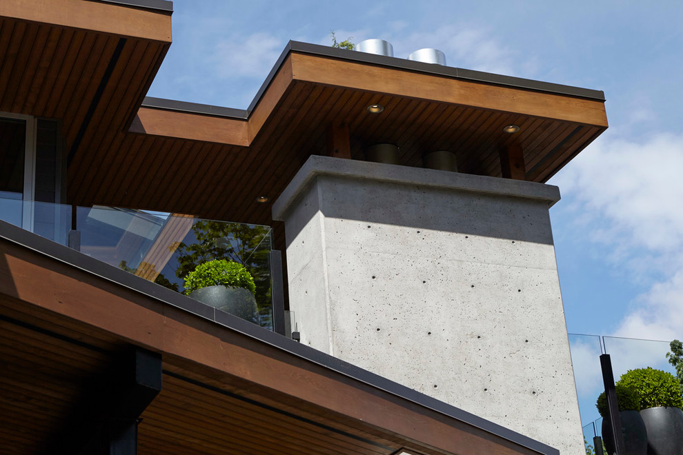 Inspiration for a large modern three-storey grey exterior in Vancouver with concrete fiberboard siding.