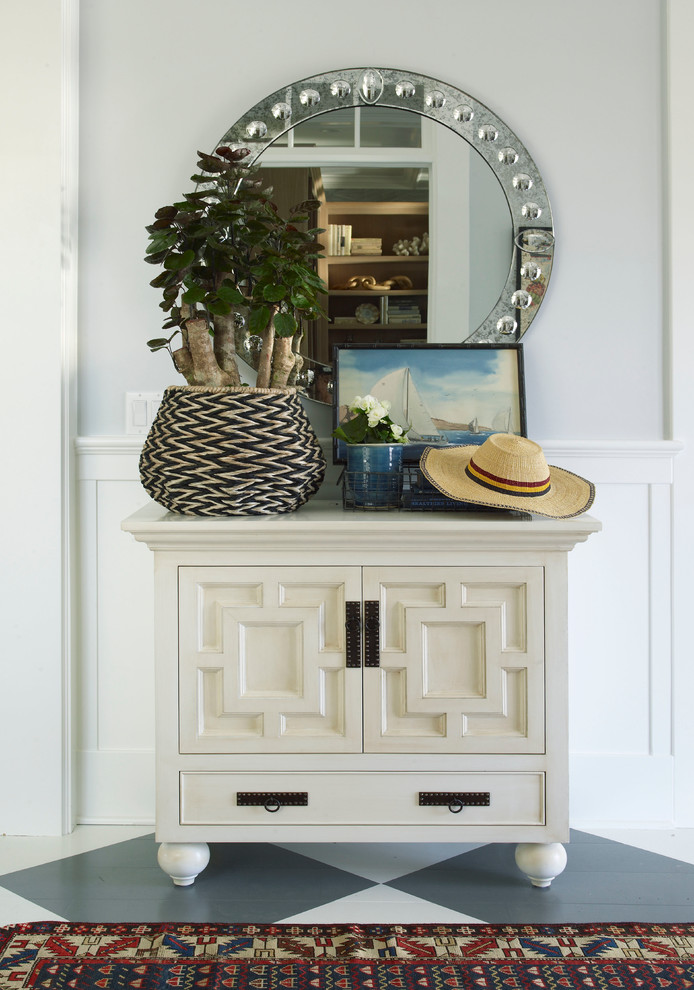 Inspiration for an entryway in San Diego with grey walls and painted wood floors.