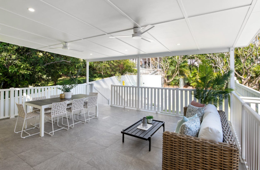 This is an example of a beach style patio in Brisbane.