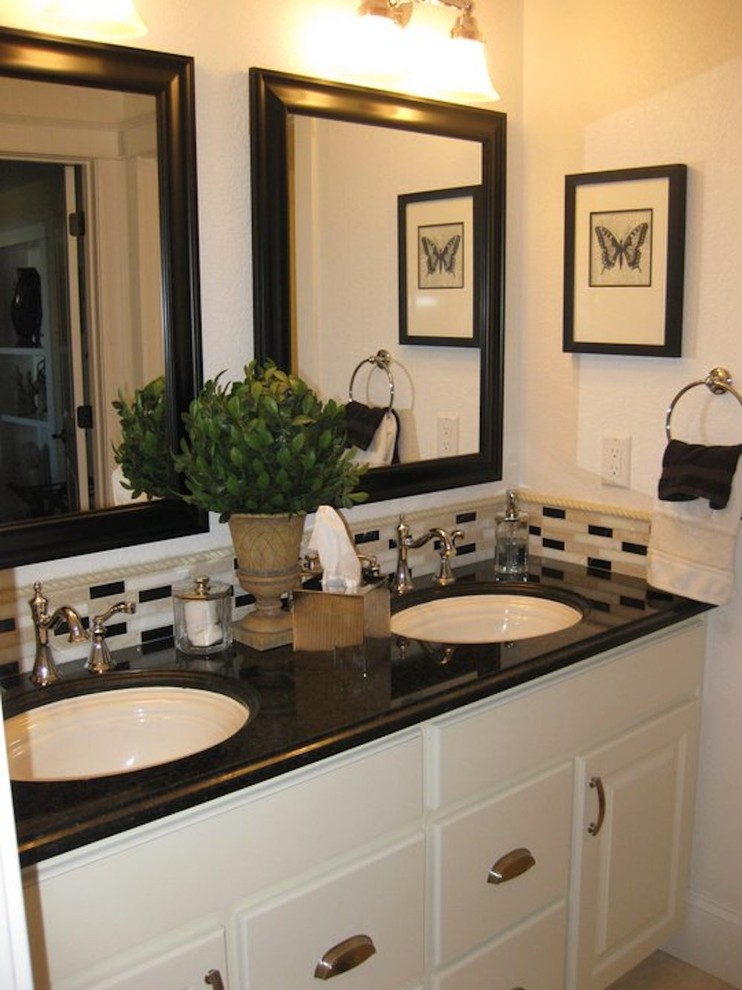Example of a small transitional 3/4 porcelain tile bathroom design with an undermount sink, raised-panel cabinets, white cabinets, granite countertops and white walls