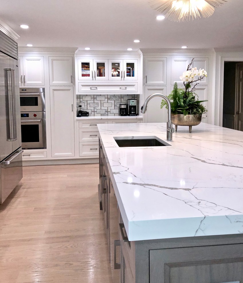 Large transitional eat-in kitchen photo in New York with beaded inset cabinets, gray cabinets, quartz countertops and an island