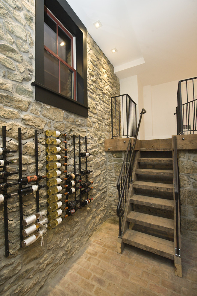 Traditional wine cellar in Philadelphia with brick floors.