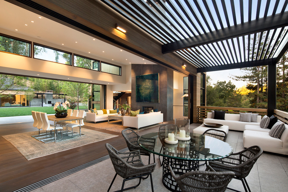 Large contemporary patio in San Francisco with tile and a pergola.
