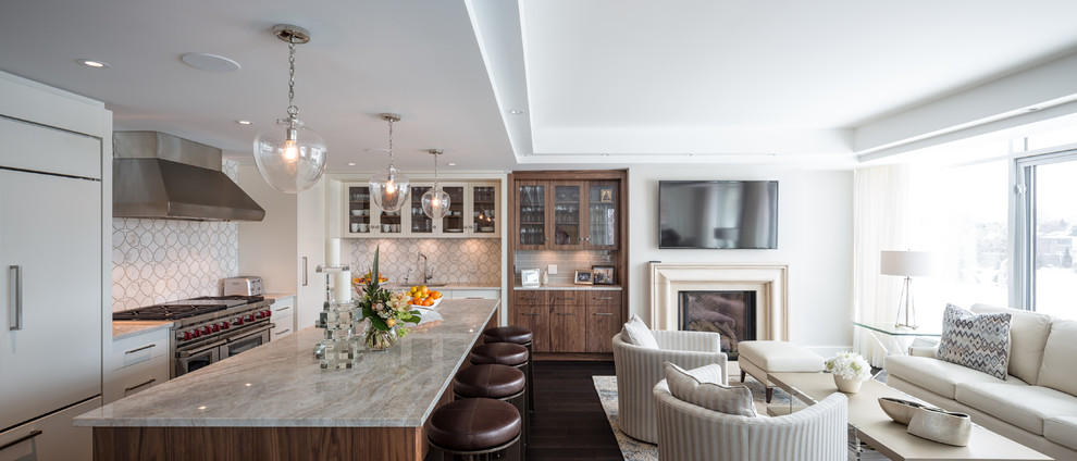 This is an example of a mid-sized contemporary l-shaped eat-in kitchen in Ottawa with an undermount sink, flat-panel cabinets, white cabinets, quartz benchtops, white splashback, mosaic tile splashback, stainless steel appliances, dark hardwood floors and with island.