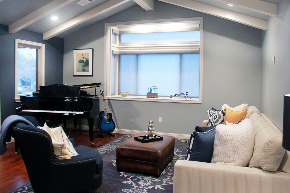Example of a small transitional enclosed dark wood floor and brown floor living room design with blue walls, no fireplace and no tv