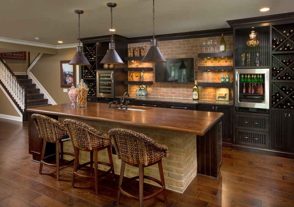 Large transitional walk-out dark wood floor basement photo in Columbus with beige walls