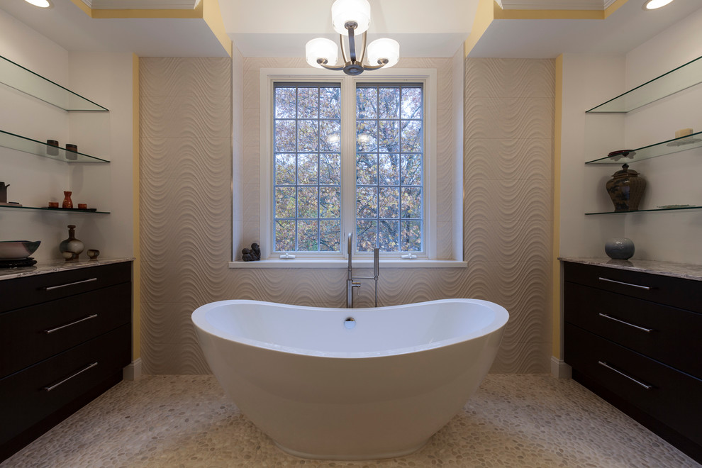 Design ideas for a large contemporary master bathroom in Bridgeport with a vessel sink, flat-panel cabinets, dark wood cabinets, onyx benchtops, a freestanding tub, a corner shower, a two-piece toilet, beige tile, porcelain tile, yellow walls and porcelain floors.