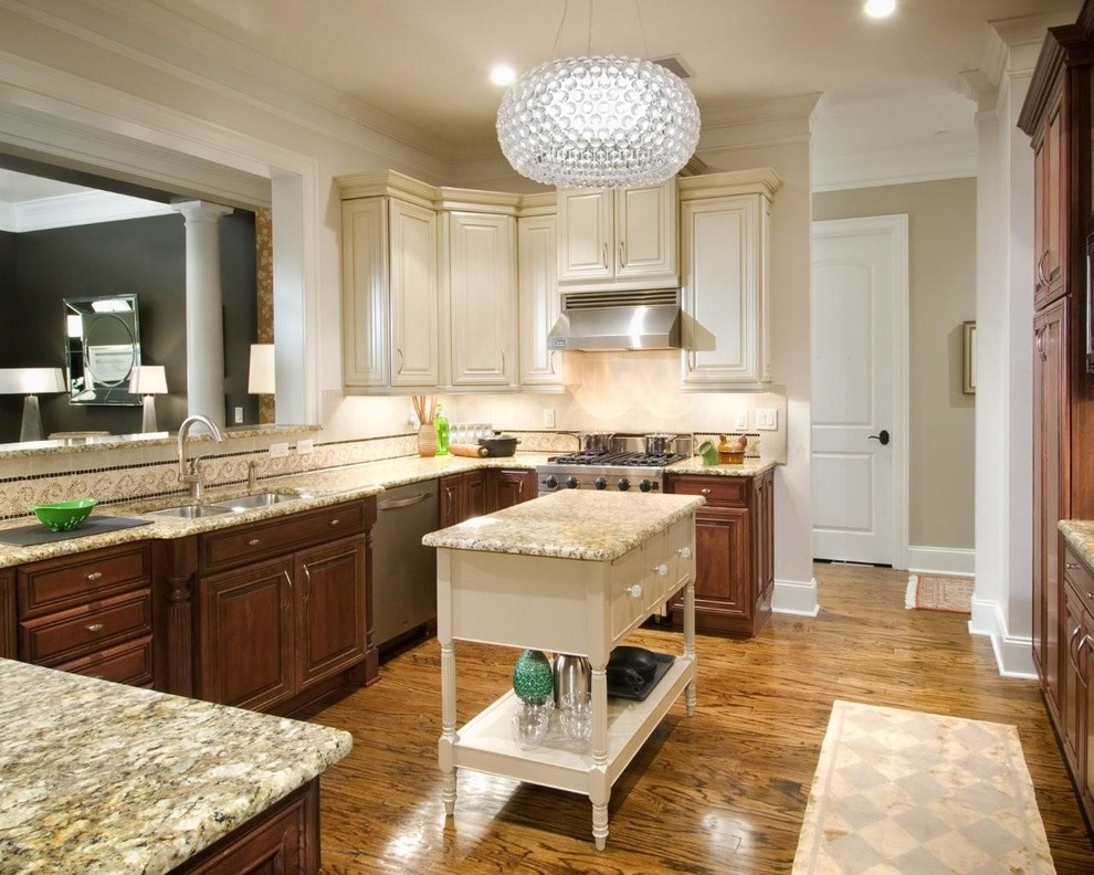 Photo of a transitional kitchen in Charlotte with a double-bowl sink.