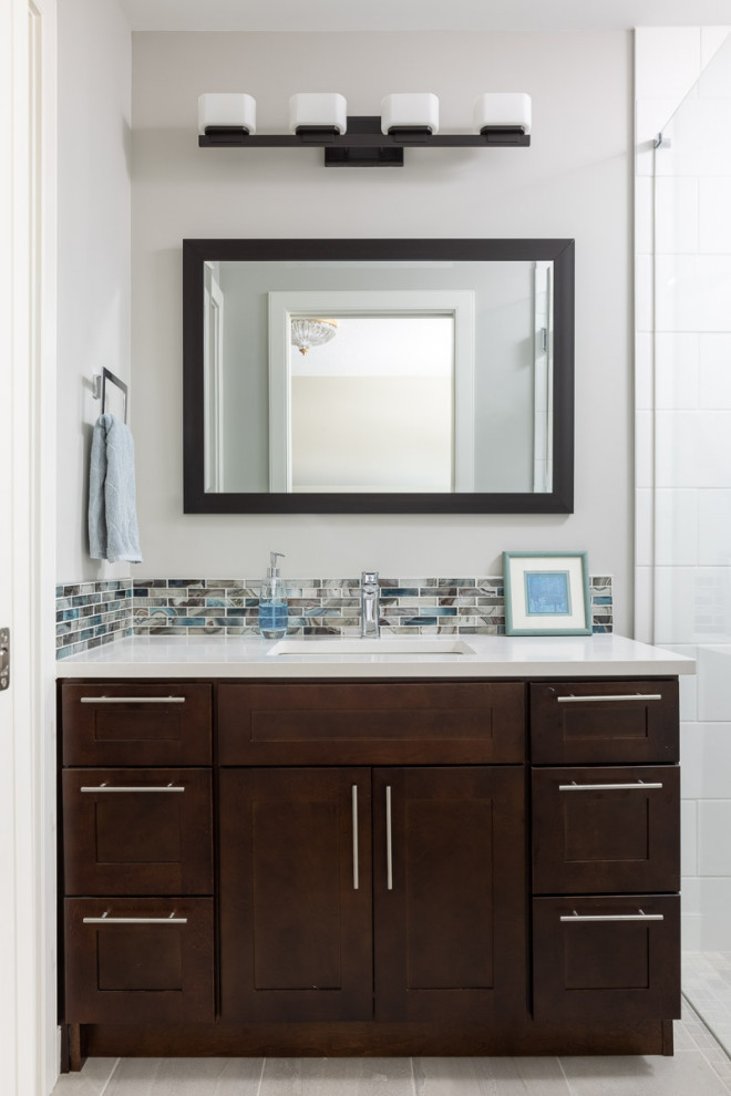 Example of a transitional home design design in Calgary