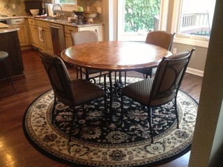 Need help on what shape rug to put under round kitchen table in small