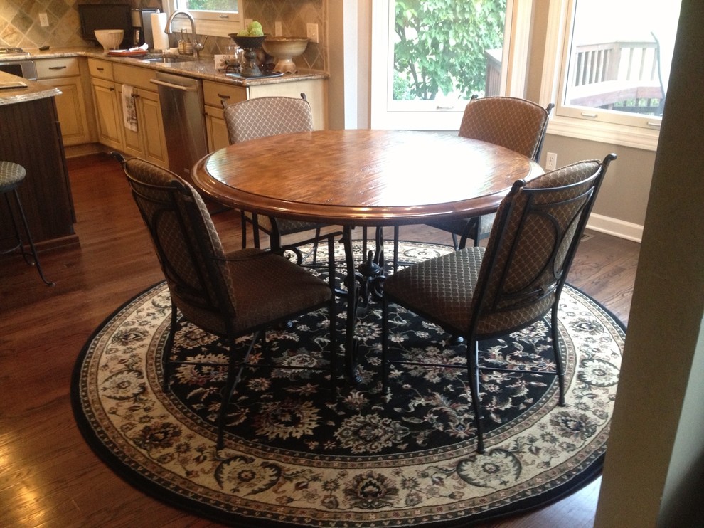 Need help on what shape rug to put under round kitchen table in small