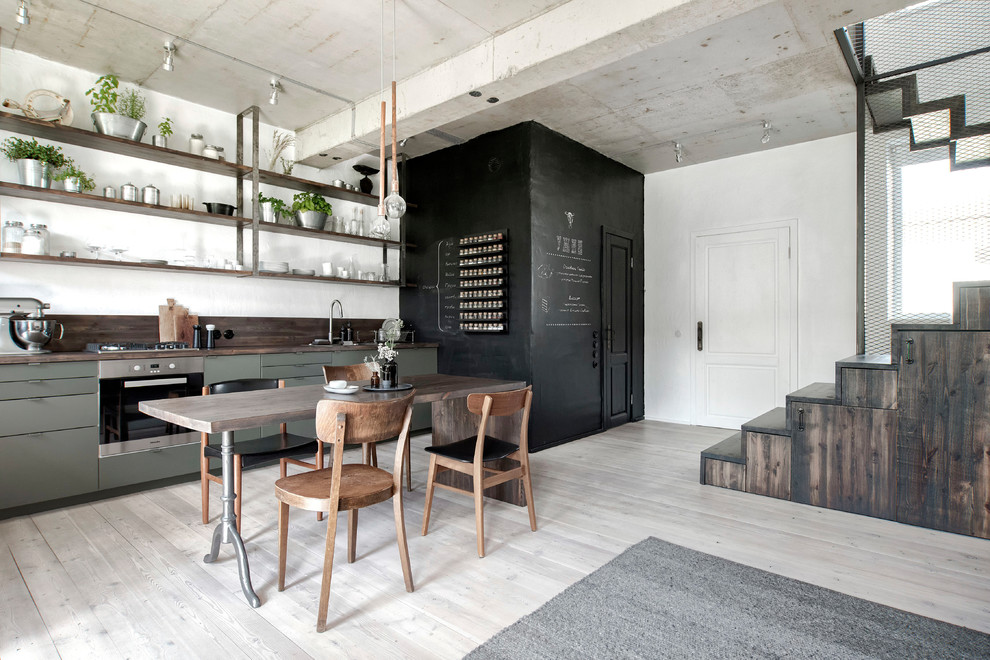 Design ideas for a small industrial single-wall eat-in kitchen in Saint Petersburg with flat-panel cabinets, wood benchtops, brown splashback, timber splashback, painted wood floors, brown benchtop, a single-bowl sink, green cabinets, stainless steel appliances and white floor.