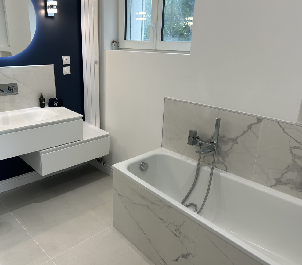 Design ideas for a medium sized contemporary bathroom in Lille with flat-panel cabinets, white cabinets, a built-in shower, white tiles, marble tiles, ceramic flooring, a console sink, beige floors, a hinged door, a single sink and a floating vanity unit.