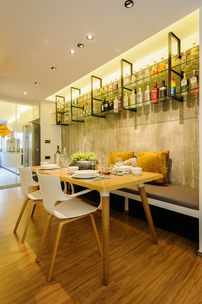 Mid-sized contemporary separate dining room in Singapore with white walls and light hardwood floors.