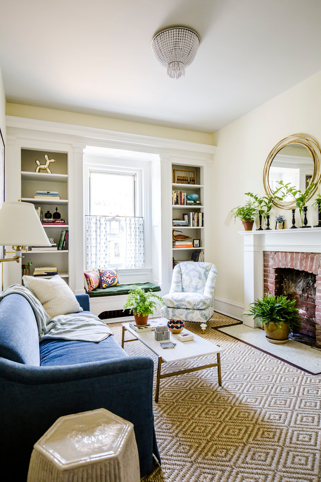 Mid-sized transitional formal living room photo with beige walls, a standard fireplace, a brick fireplace and no tv