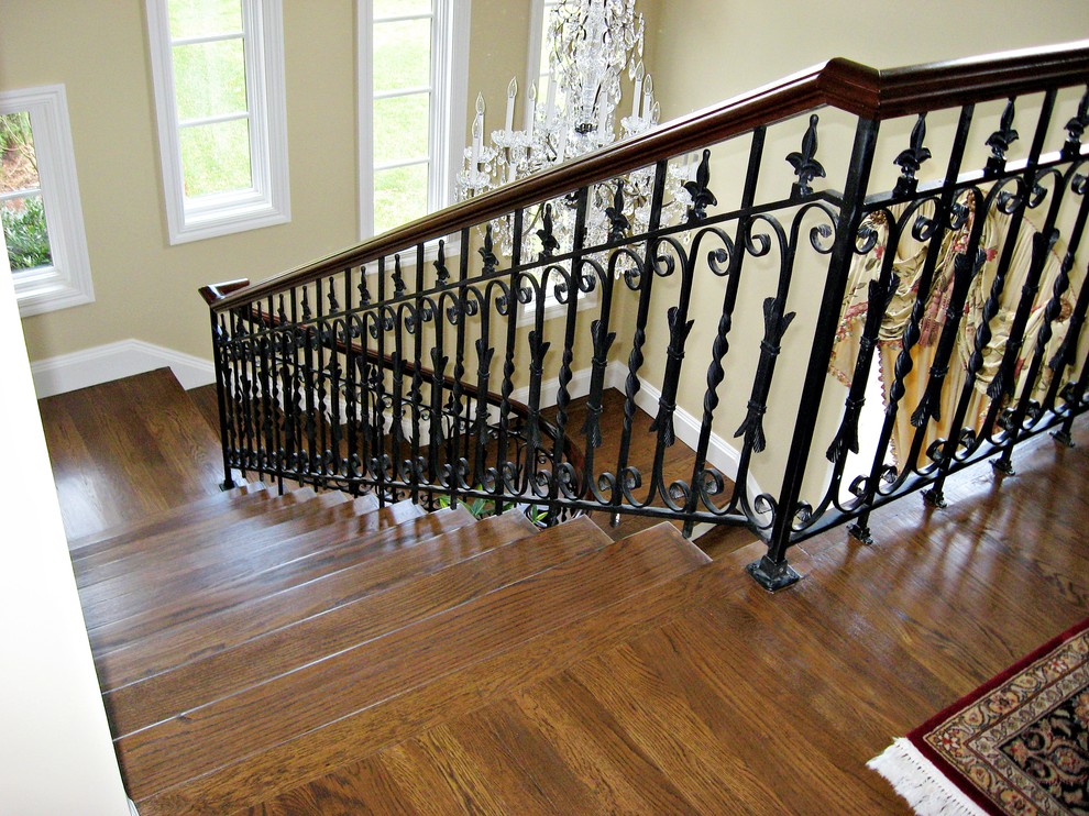 Design ideas for a mid-sized traditional wood l-shaped staircase in New York with painted wood risers.