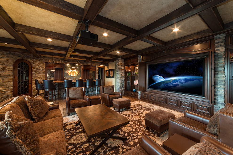 Photo of a traditional enclosed home theatre with a projector screen.