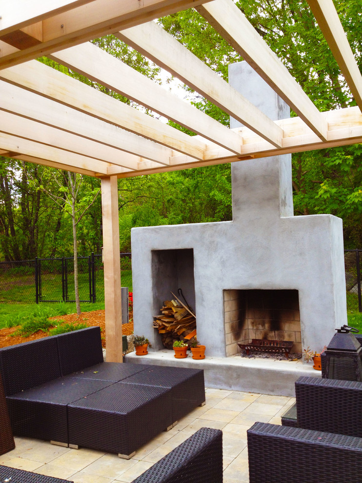 Photo of a mid-sized contemporary backyard patio in Providence with a fire feature, concrete pavers and a pergola.