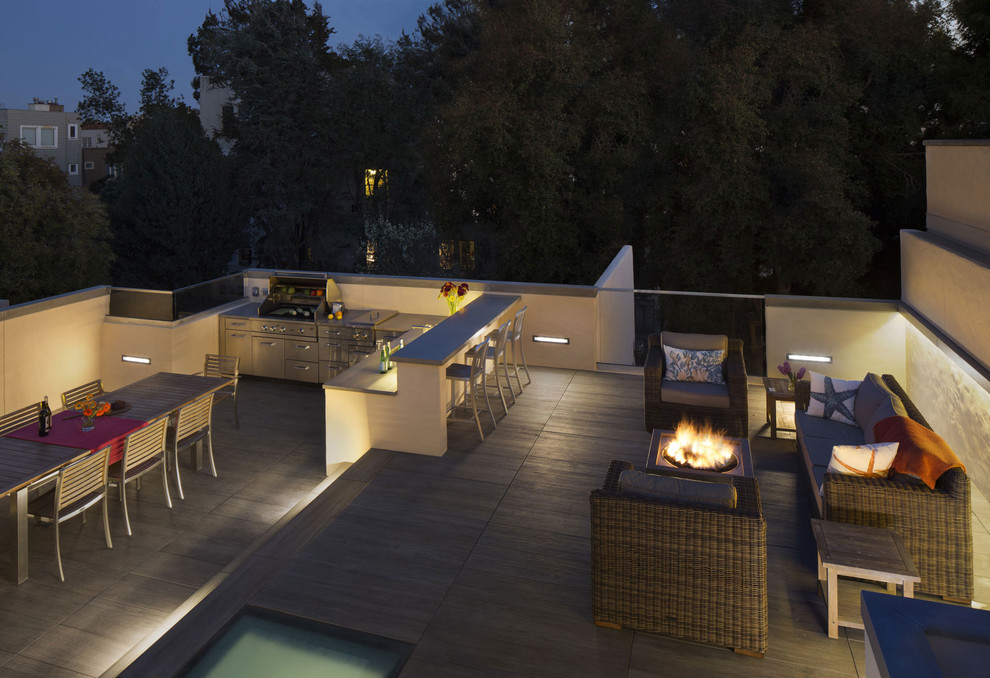 Photo of a mid-sized contemporary rooftop deck in San Francisco with an outdoor kitchen and no cover.