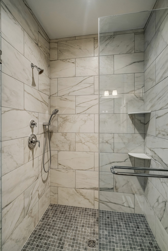 Photo of a mid-sized arts and crafts master bathroom in Other with raised-panel cabinets, white cabinets, a curbless shower, a one-piece toilet, gray tile, blue walls, dark hardwood floors, an undermount sink and marble benchtops.