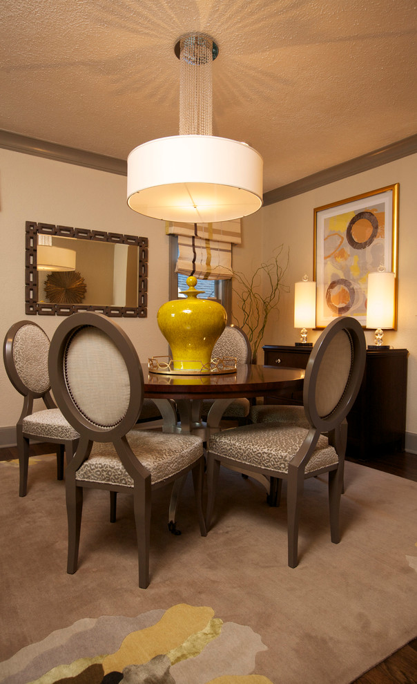 Inspiration for a traditional dining room in Chicago with beige walls and dark hardwood floors.