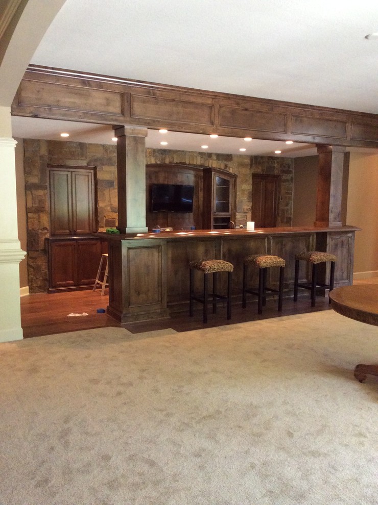 Inspiration for a mid-sized traditional basement in Kansas City with brown walls, carpet and no fireplace.