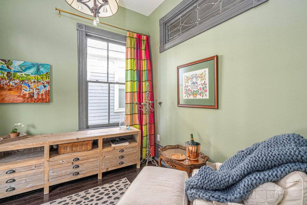 Photo of a small classic guest bedroom in Other with green walls, dark hardwood flooring and black floors.