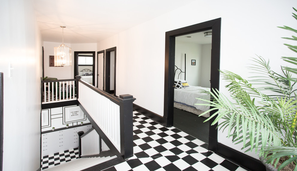 Hallway - mid-sized transitional vinyl floor and black floor hallway idea with white walls