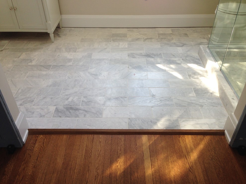Transitional master white tile and stone tile marble floor corner shower photo in Cincinnati with a two-piece toilet and beige walls
