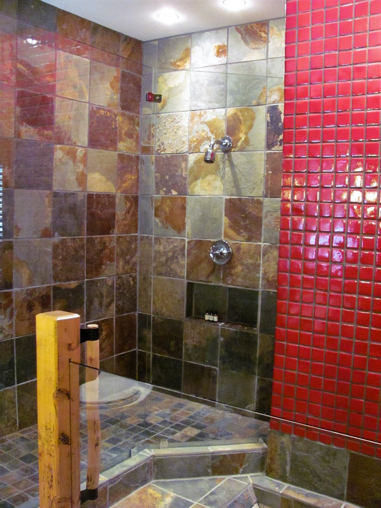 Example of a large mountain style master slate floor alcove bathtub design with granite countertops
